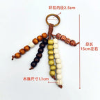 Vintage Boho Wooden Bead Bag Charm Keychain – Handmade Tassel Pendant for Handbags, Backpacks & Car Keys